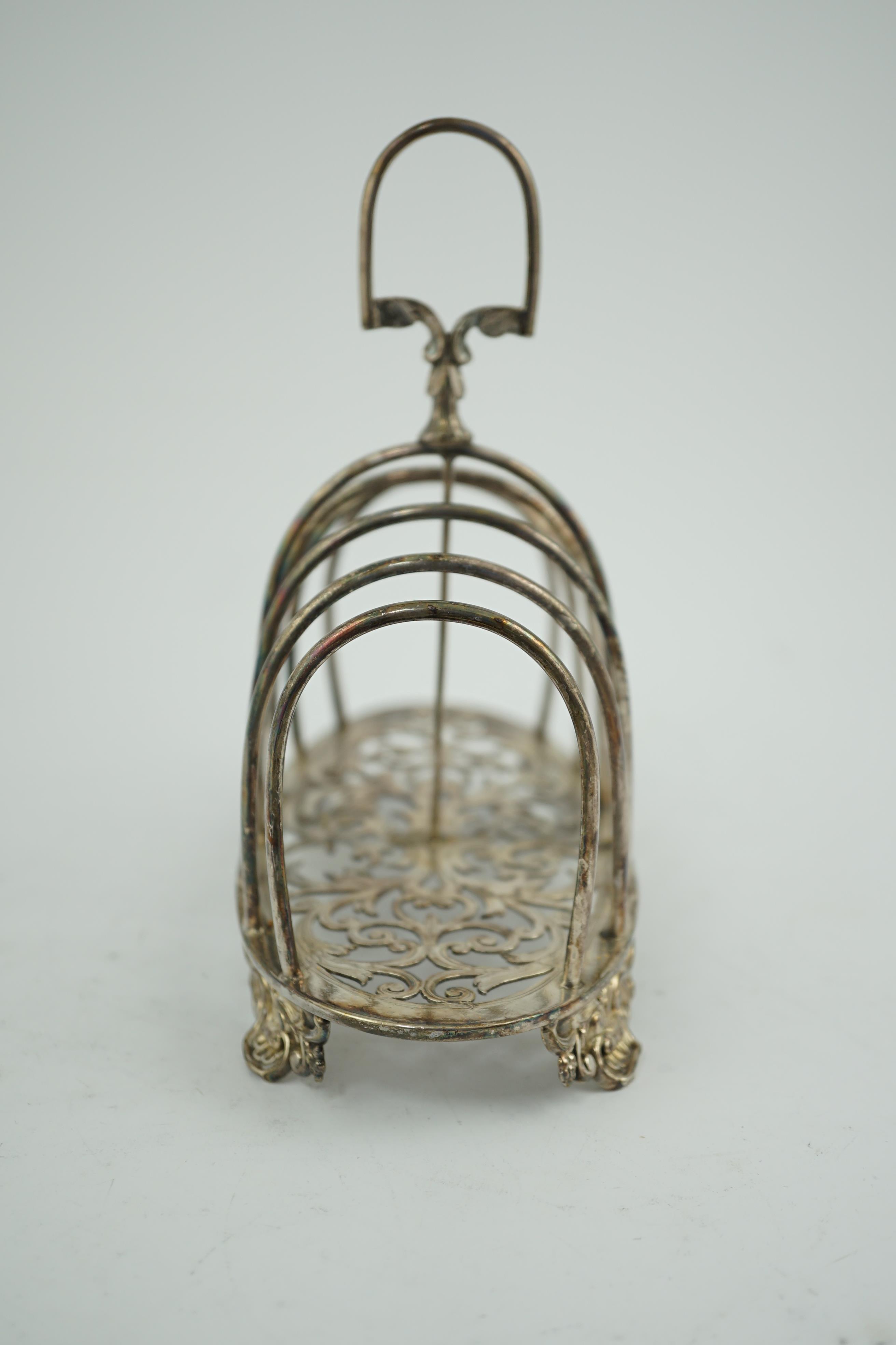 A Victorian silver seven bar toast rack, by Henry Holland